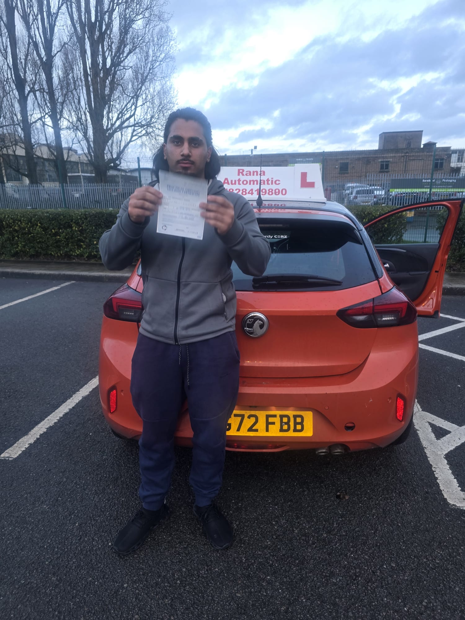Successful student with driving pass certificate